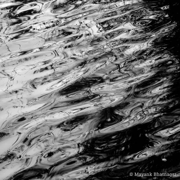 Abstract, black and white square format photograph of water